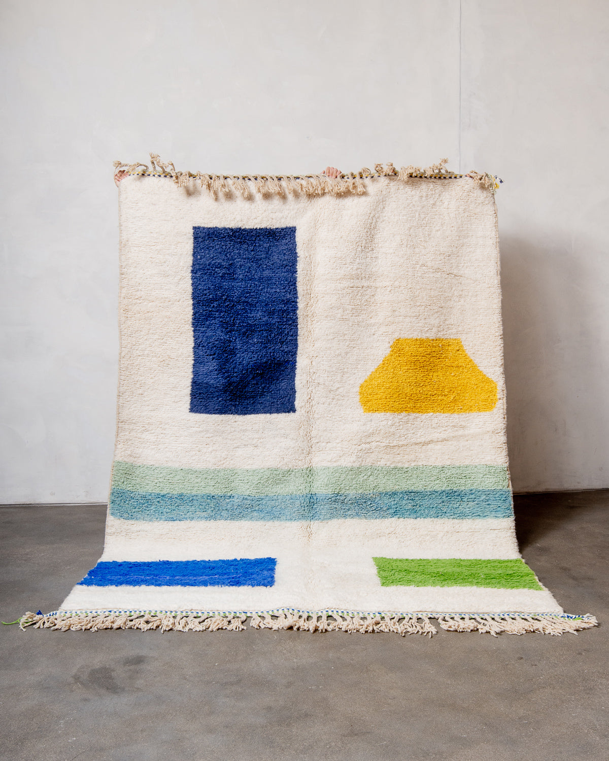 Modern, designer, handcrafted Berber rug from Morocco. Beniourain carpet with beautiful colours and patterns and fluffy wool texture.